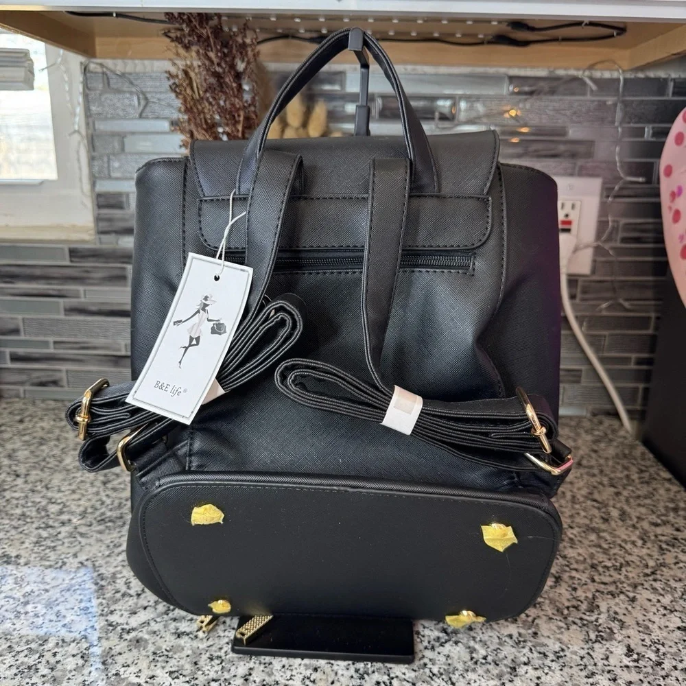 Brand New With Tags Black Backpack with Gold Accents